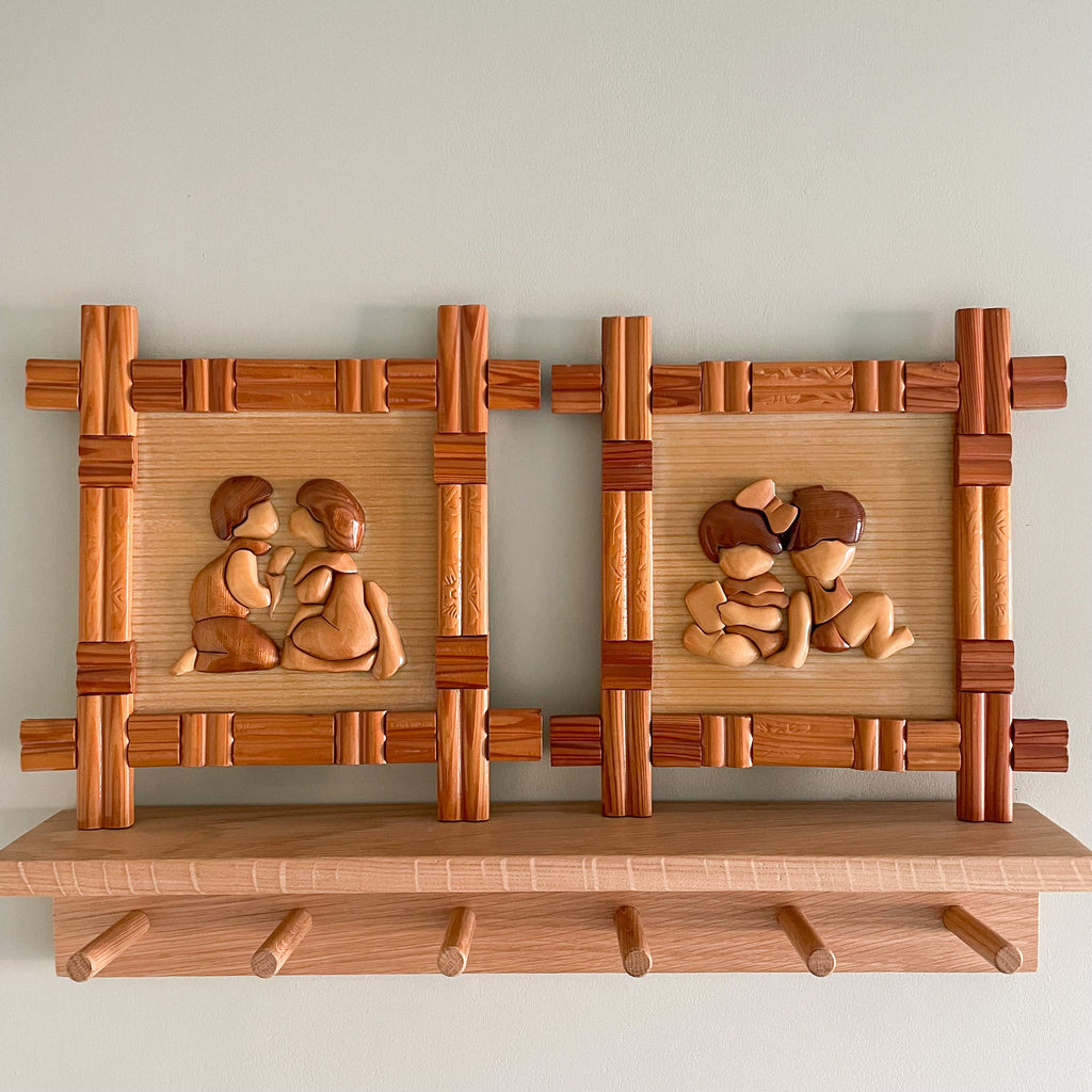 Pair of wooden and bamboo framed wall plaques each featuring two small children, East Asian - Moppet