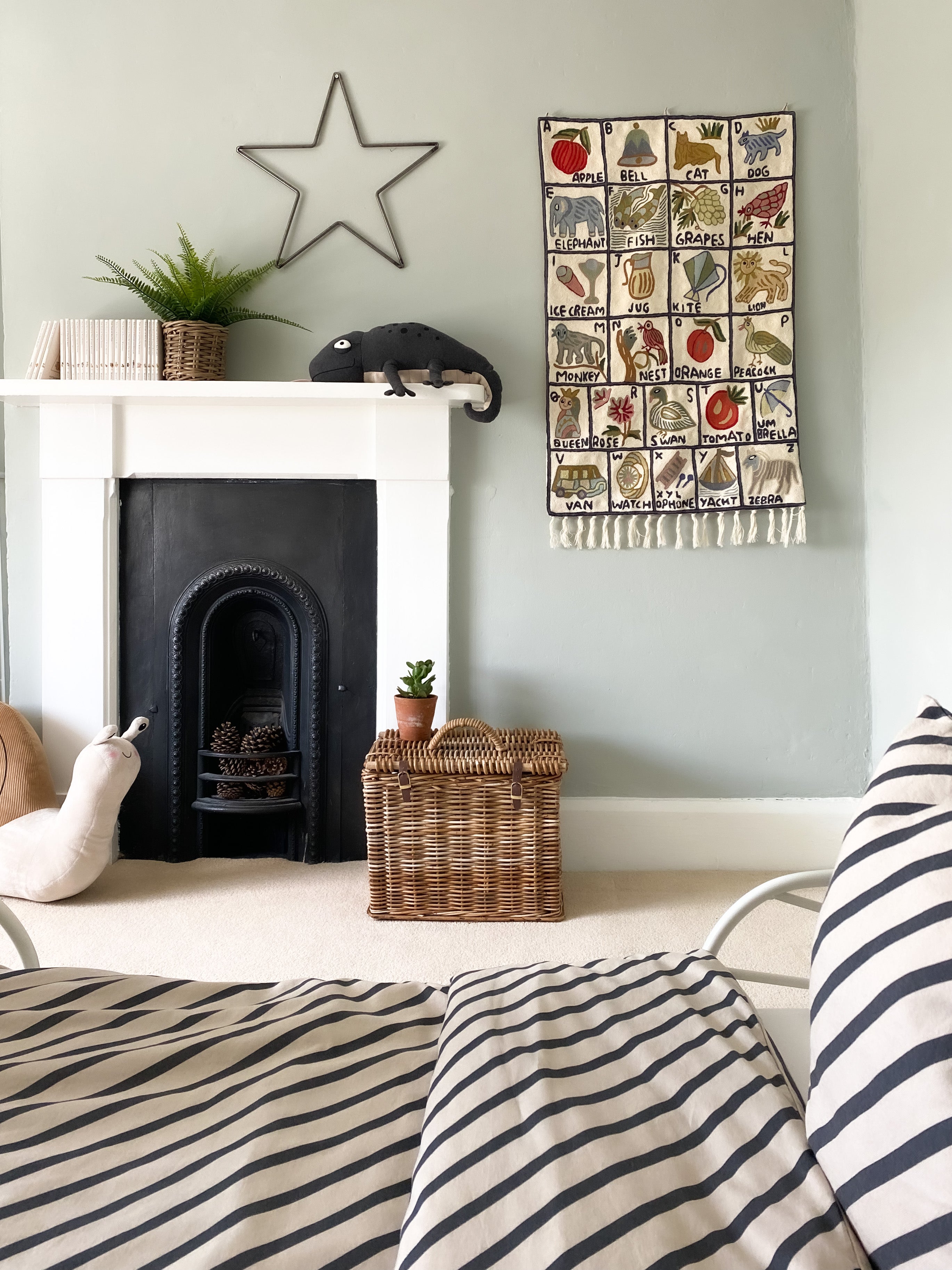 Moppet Sumbal alphabet wall hanging hanging on the wall at @figtree.farm