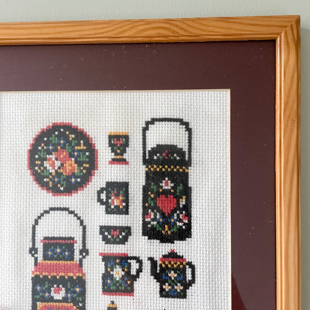 Vintage framed cross-stich embroidery or needlework of Scandinavian teapots, cups and kitchenware - Moppet