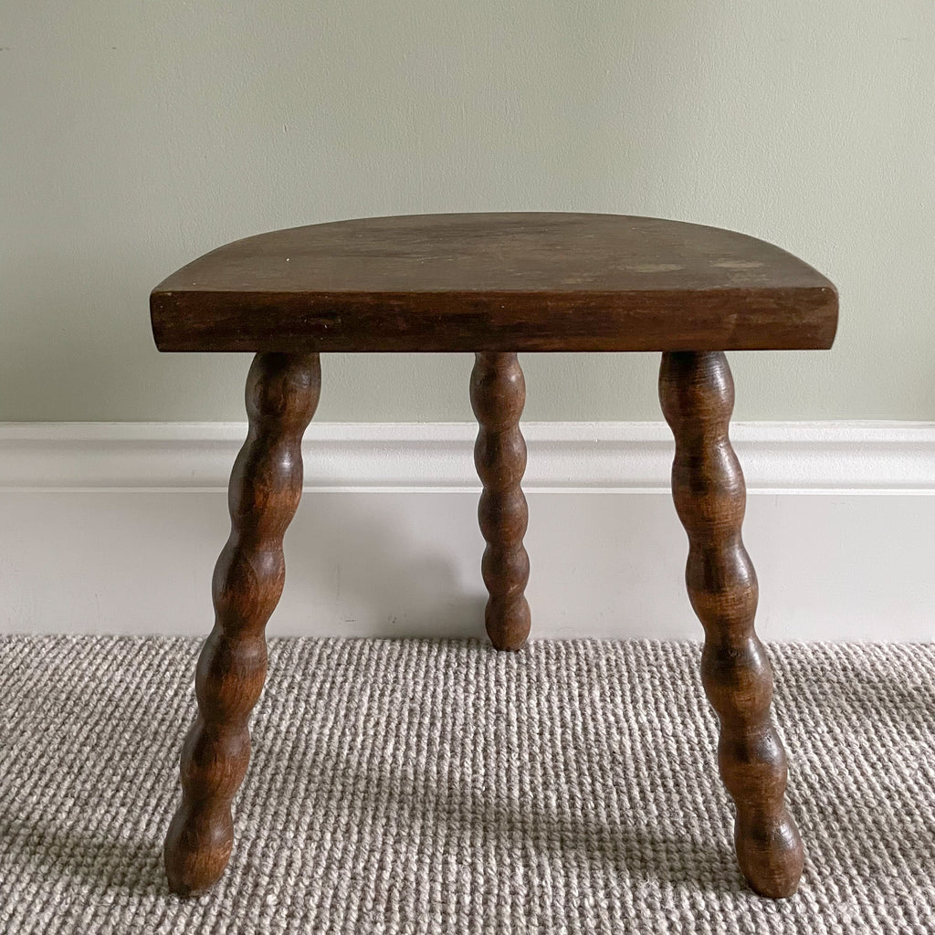 Vintage wooden French milking stool with three bobbin turned legs and a half-moon seat - Moppet