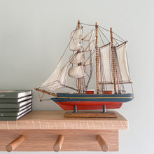 Load image into Gallery viewer, Vintage wooden model sailing ship with blue and red paintwork - Moppet

