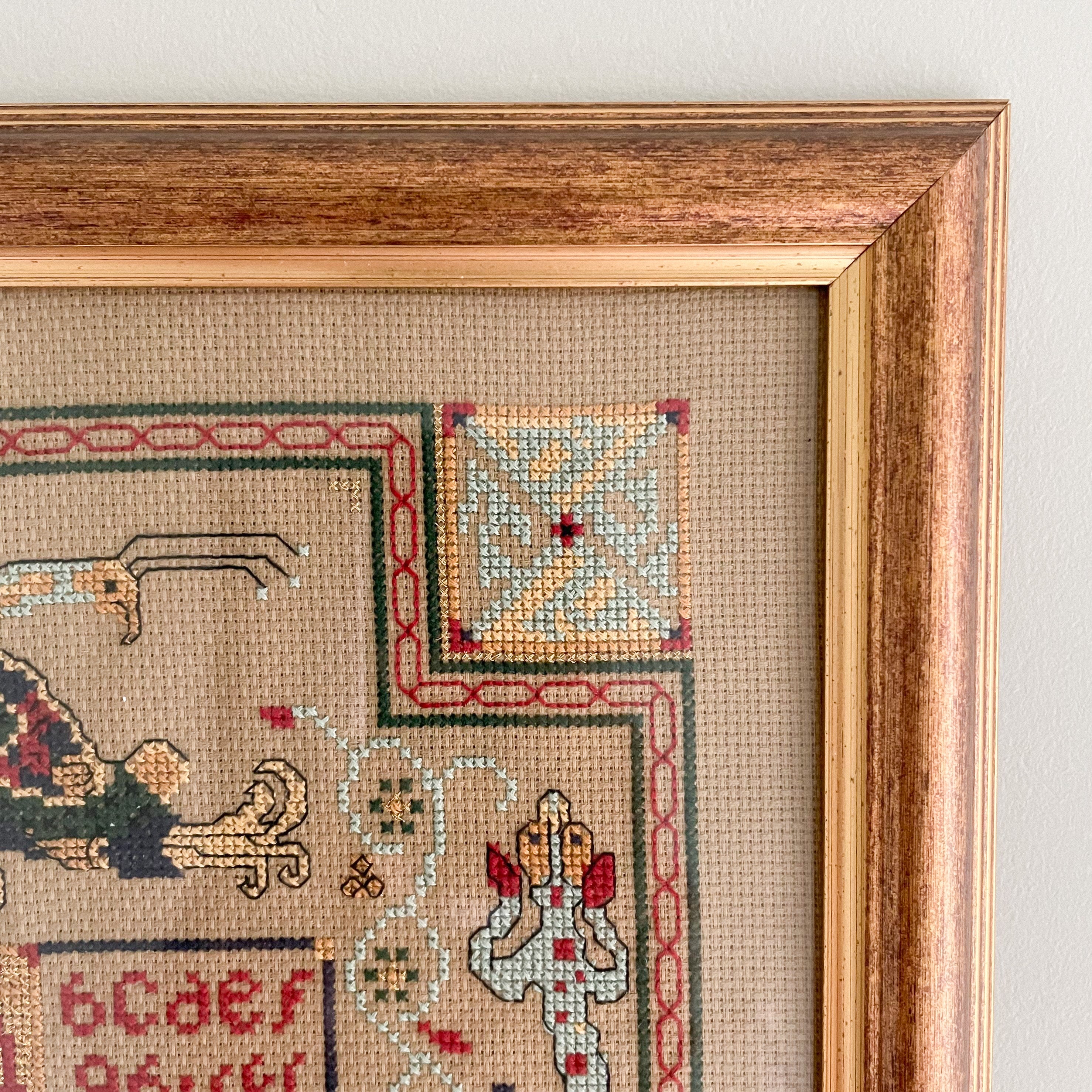 Vintage framed cross stitch embroidery of alphabet and cat - Moppet