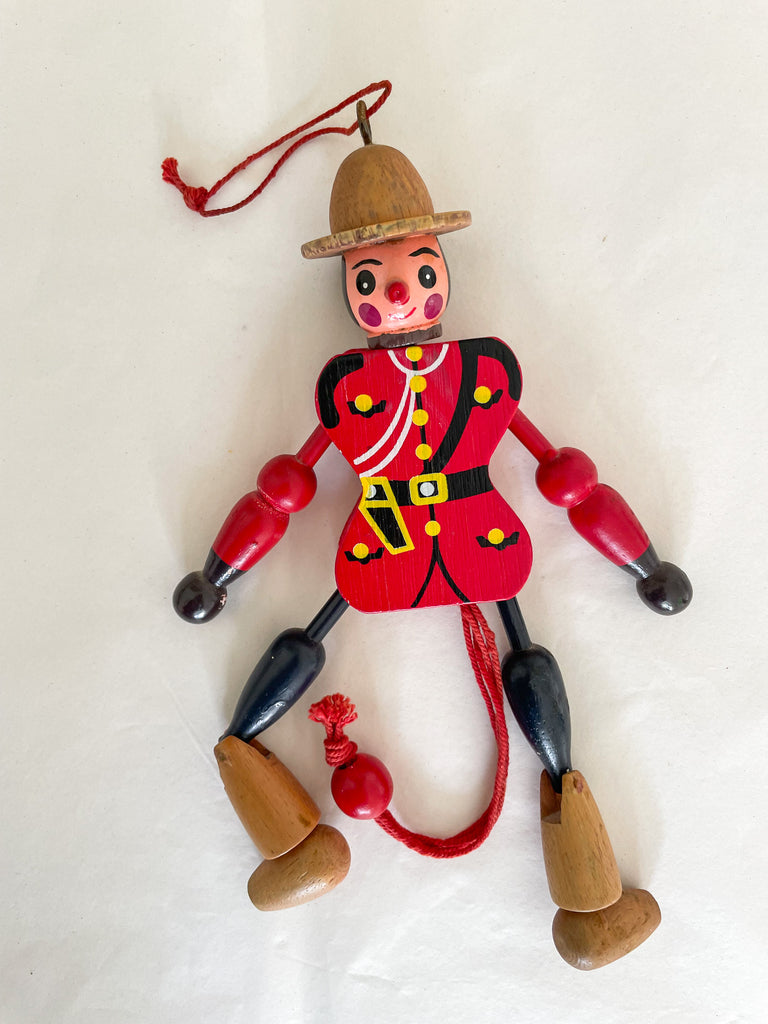 Vintage Canadian Mountie jumping-jack pull toy - Moppet