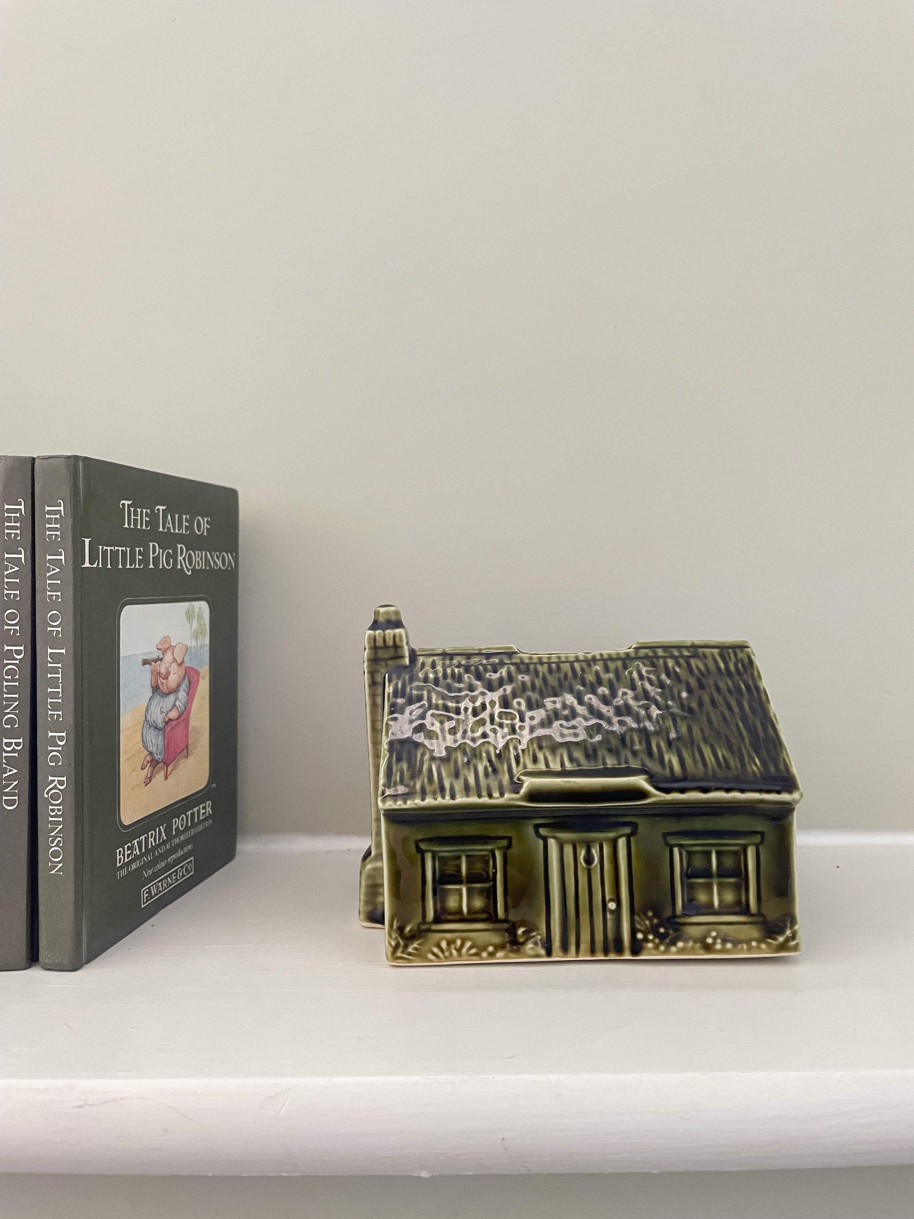 Vintage ceramic house money box in olive green, by Holkham Pottery - Moppet